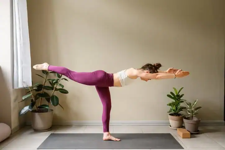 Woman doing Yoga exercise Hemel Hempstead to help with toning the body. 