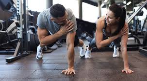 Sculpting Sleek Arms: The Essential Role of Cardio in Toning Without Bulking Up 1 Image of man and woman doing Cardio Hemel Hempstead to tone their arms.